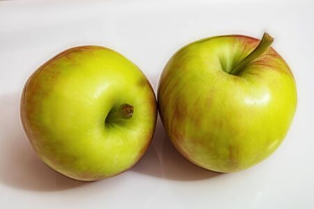 close up red and green apple