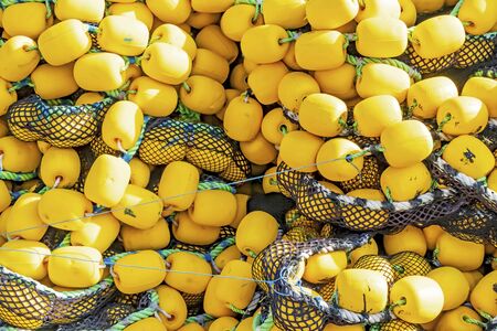 close up yellow colored fishing net