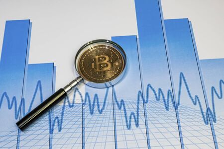 close up bitcoin coin with magnifying glass  on background