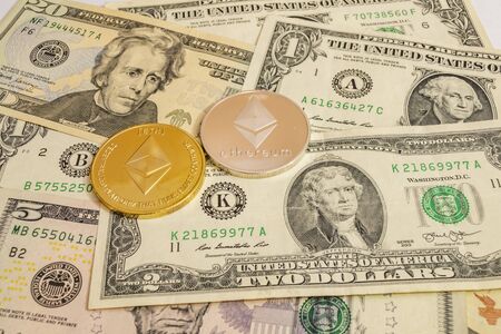 close up cryptocurrency coins on banknotes backgroundの写真素材
