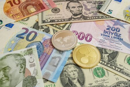 close up cryptocurrency coins on banknotes background