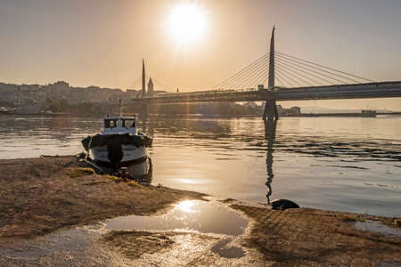 halic, istanbul, turkey-june 8,2020. landscape and cityscape from goldenhorn with metro bridge and boat in the morning time.のeditorial素材