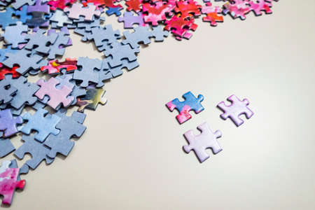 close up jigsaw puzzle pieces on background