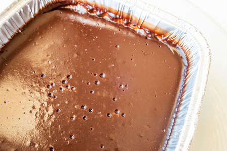 chocolate pudding in aluminum bowl in restaurant