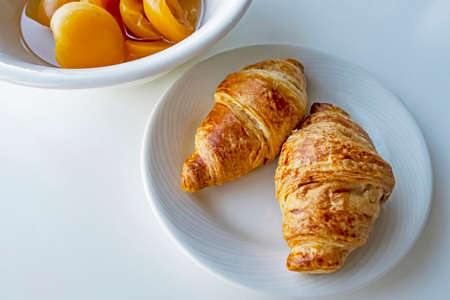 France's national food croissant on a white plate