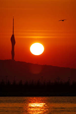 sunrise and camlica tower silhouette in istanbulの写真素材