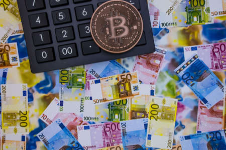 istanbul, turkey-may 21,2021.cryptocurrency mining and bitcoin coin for finance and economy with calculator.のeditorial素材