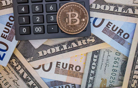 istanbul, turkey-may 21,2021.cryptocurrency mining and bitcoin coin for finance and economy with calculator.のeditorial素材