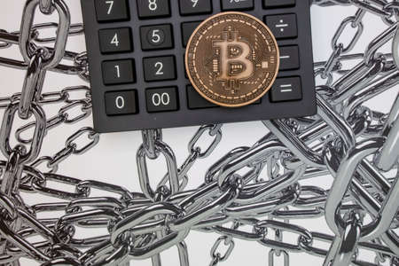 istanbul, turkey-may 21,2021.cryptocurrency mining and bitcoin coin for finance and economy with calculator.のeditorial素材