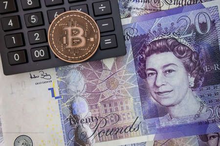 istanbul, turkey-may 21,2021.cryptocurrency mining and bitcoin coin for finance and economy with calculator.のeditorial素材