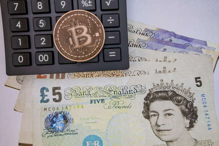 istanbul, turkey-may 21,2021.cryptocurrency mining and bitcoin coin for finance and economy with calculator.のeditorial素材