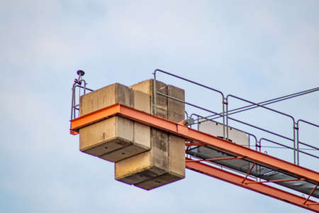 construction crane loaded with construction materialの写真素材