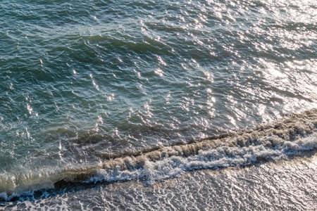 clear sea and waves on the shore in summerの写真素材