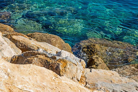 clear and blue waters of the aegean sea for tourists who love vacation and sea in summerの写真素材