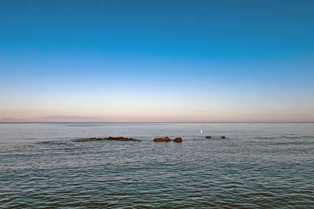 clear and blue waters of the aegean sea for tourists who love vacation and sea in summerの写真素材