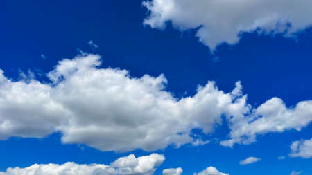 blue sky with white cloudsの写真素材