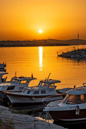 istanbul,Turkey-August 6,2021.Sunrise and fishing boats in the sea of Marmara in Yedikule district,istanbul city.のeditorial素材