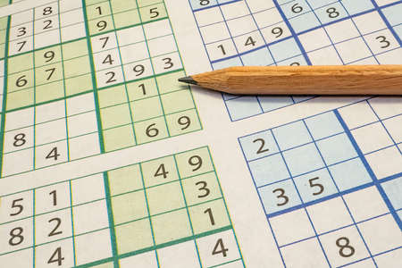 Puzzle and pencil for leisure and entertainmentの写真素材