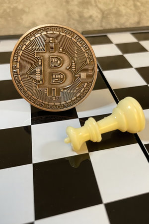 istanbul,Turkey.June 22,2022.cryptocurrency mining. Close-up bitcoin coin and chess gameのeditorial素材