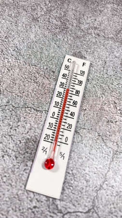 thermometer on the gray background