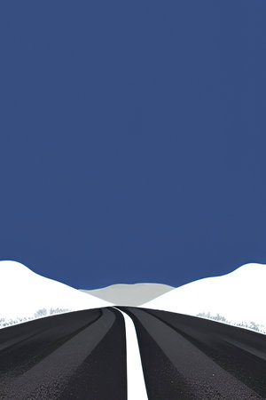 Asphalt road in the winter mountains with snow and blue sky.