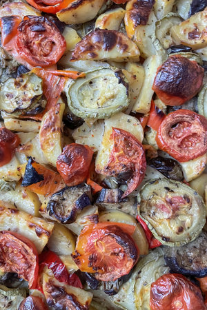 Baked vegetables with onions, tomatoes and mushrooms. selective focus.の写真素材