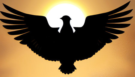 Silhouette of a flying seagull on a yellow background with a sunの写真素材