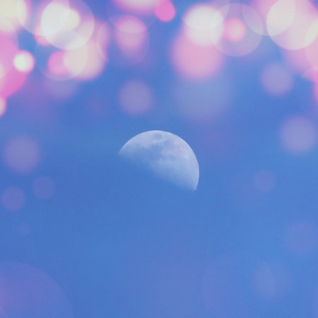 Moon and bokeh on blue sky background. vintage style.の写真素材