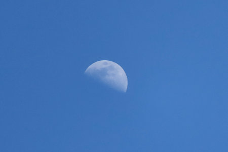 Moon in the blue sky, closeup of photo with soft focusの写真素材