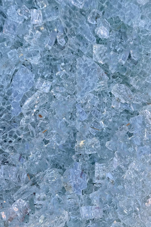 abstract background of broken glass with cracks and a lot of holes