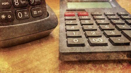 Calculator on wood table background. Business concept. vintage style.の写真素材