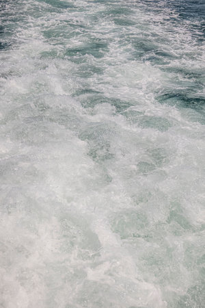 Waves on the water of the sea as a background. texture