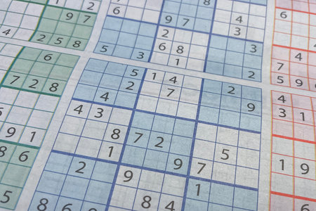 Close up of a crossword puzzle with numbers in a grid.の写真素材