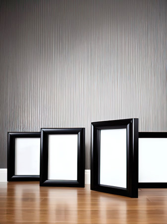 Three black frames on the wooden floor in the room with a wallの素材