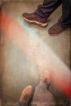 Selfie of shoes on grunge background with light beam and shadow