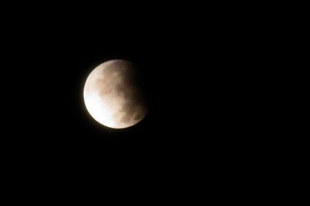 Partial Lunar Eclipse Night Sky.A dramatic night sky photo taken during a partial lunar eclipse.