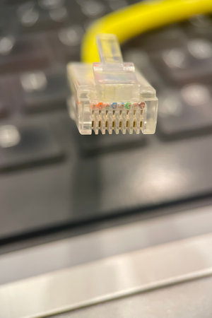 close up of network cable on a laptop computer in a technology concept.Ethernet Cable Close-up.
