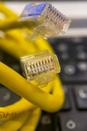 close up of network cable and keyboard in data center (selective focus).Ethernet Cable Close-up.の写真素材