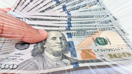 A Fan of $100 Bills.A close-up photo of a fan of $100 US dollar bills. The bills are arranged...