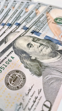 A Fan of $100 Bills.A close-up photo of a fan of $100 US dollar bills. The bills are arranged...