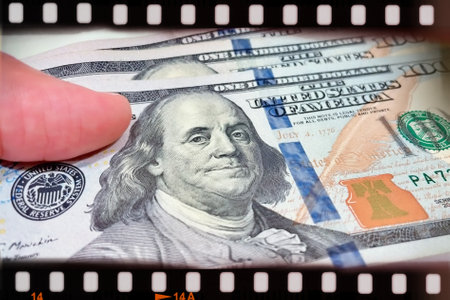 A Fan of $100 Bills.A close-up photo of a fan of $100 US dollar bills. The bills are arranged...