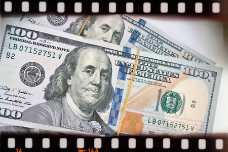 A Fan of $100 Bills.A close-up photo of a fan of $100 US dollar bills. The bills are arranged...