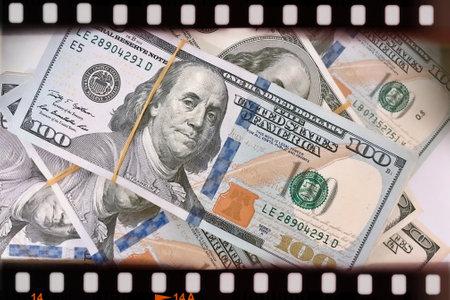 A Fan of $100 Bills.A close-up photo of a fan of $100 US dollar bills. The bills are arranged neatly, with the portrait of Benjamin Franklin visible on each bill.の写真素材