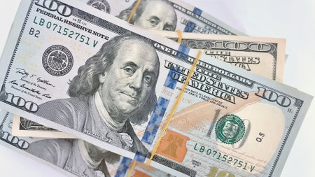 A Fan of $100 Bills.A close-up photo of a fan of $100 US dollar bills. The bills are arranged...