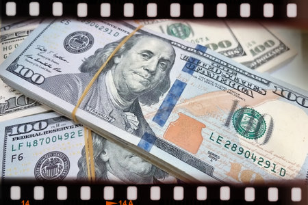 A Fan of $100 Bills.A close-up photo of a fan of $100 US dollar bills. The bills are arranged neatly, with the portrait of Benjamin Franklin visible on each bill.の写真素材