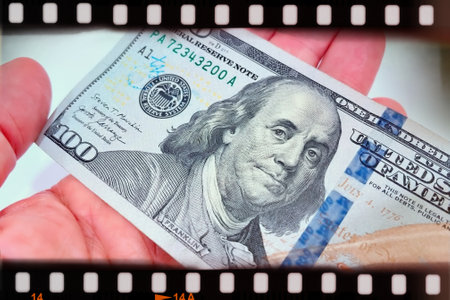 A Fan of $100 Bills.A close-up photo of a fan of $100 US dollar bills. The bills are arranged...