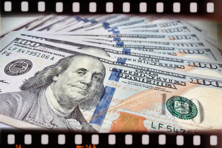 A Fan of $100 Bills.A close-up photo of a fan of $100 US dollar bills. The bills are arranged neatly, with the portrait of Benjamin Franklin visible on each bill.の写真素材