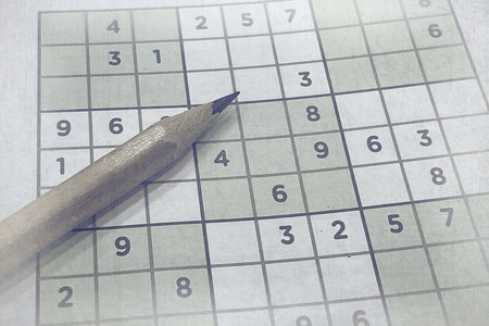 Pen on Partially Solved Sudoku Puzzle â€“ Logic Game for Mental Focus and Brain-Boosting...