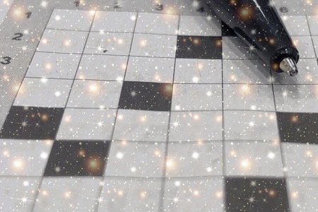 Sparkling Crossword Puzzle. A magical close-up of a crossword grid with a pencil. Perfect for themes of creativity, intelligence, and puzzles.の写真素材