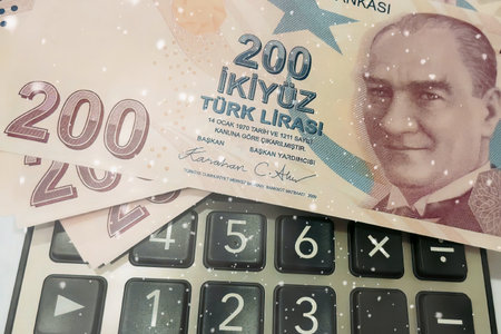 Turkish Lira and Calculator Finance Concept.200 TRY banknotes on calculator representing Turkish economy, budgeting, and financial planning.の写真素材